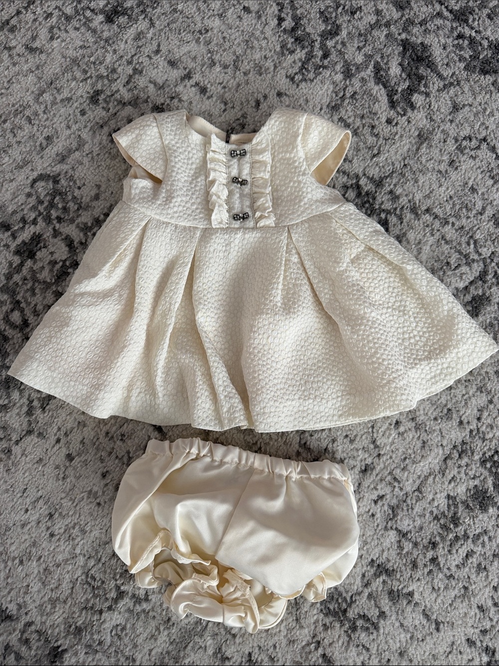 Pippa & Julie Ivory Textured Dress with Ruffle Front and Matching Bloomers